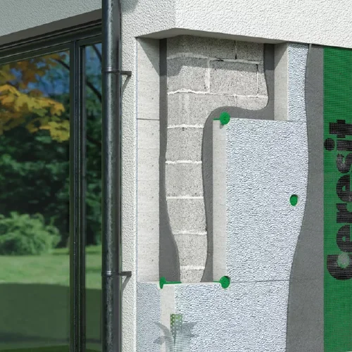 Cross-section showing white EPS polystyrene boards installed in an external wall system.