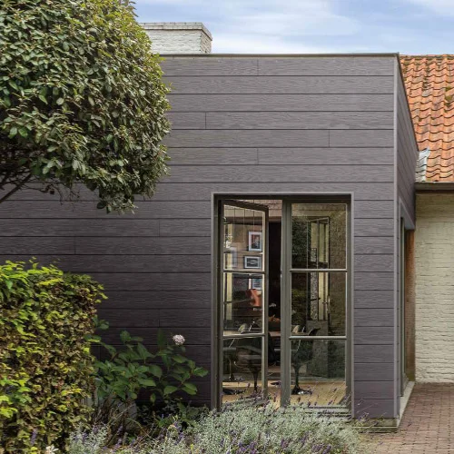 Grey weatherboard cladding installed on the exterior walls of a home.