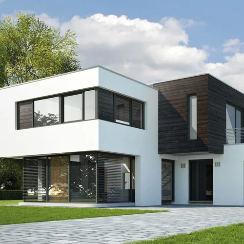 Modern white residential house featuring an insulated external wall render system.