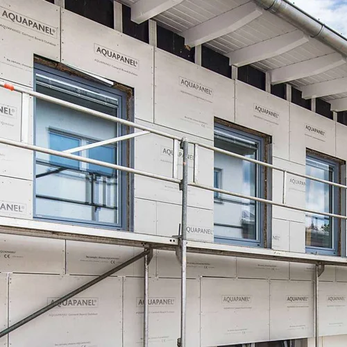 Cement boards installed on the exterior facade framework of a building.