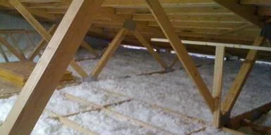 Blown in loft insulation under roof rafters