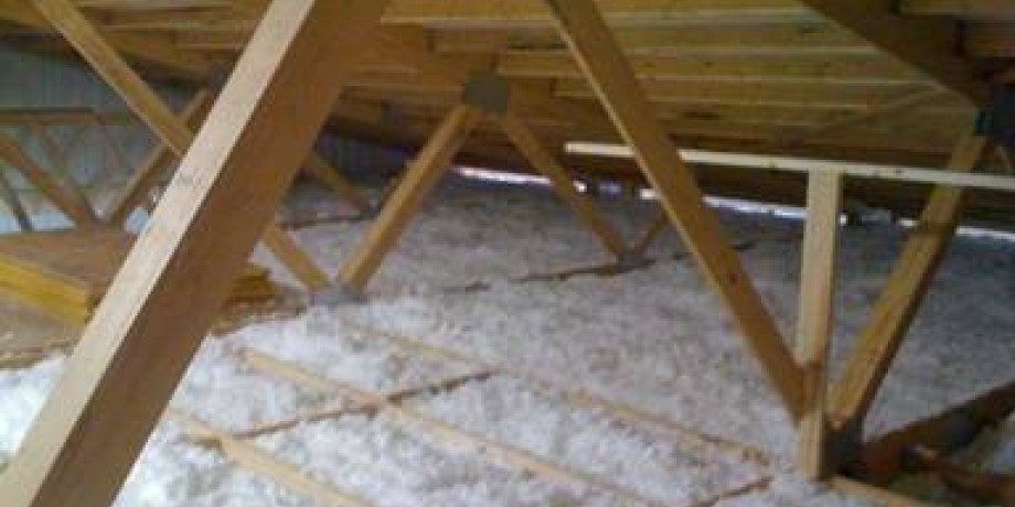 Blown in loft insulation under roof rafters