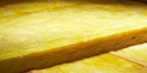 Roll of yellow mineral wool insulation material