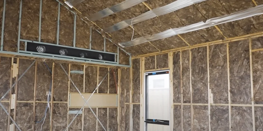 Interior room showing the installation of acoustic insulation panels