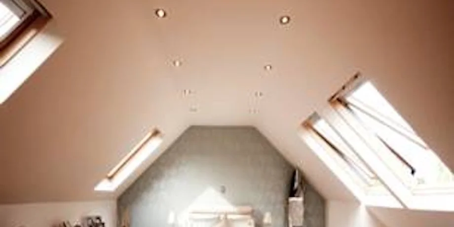 Interior of a modern loft bedroom conversion with skylights