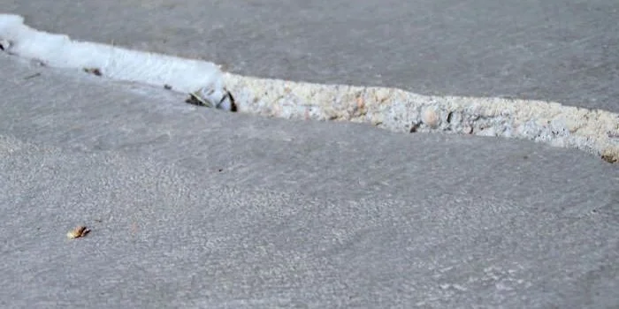 Concrete floor slab with a visible gap or void former