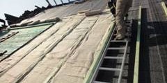 Roll of pink fiberglass insulation standing upright