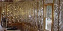 Attic room completely lined with shiny foil insulation