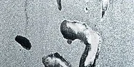 Close-up of water droplets condensing on a surface